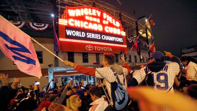 Cubs fans celebrate the World Series victory outside the famous Wrigley Field.