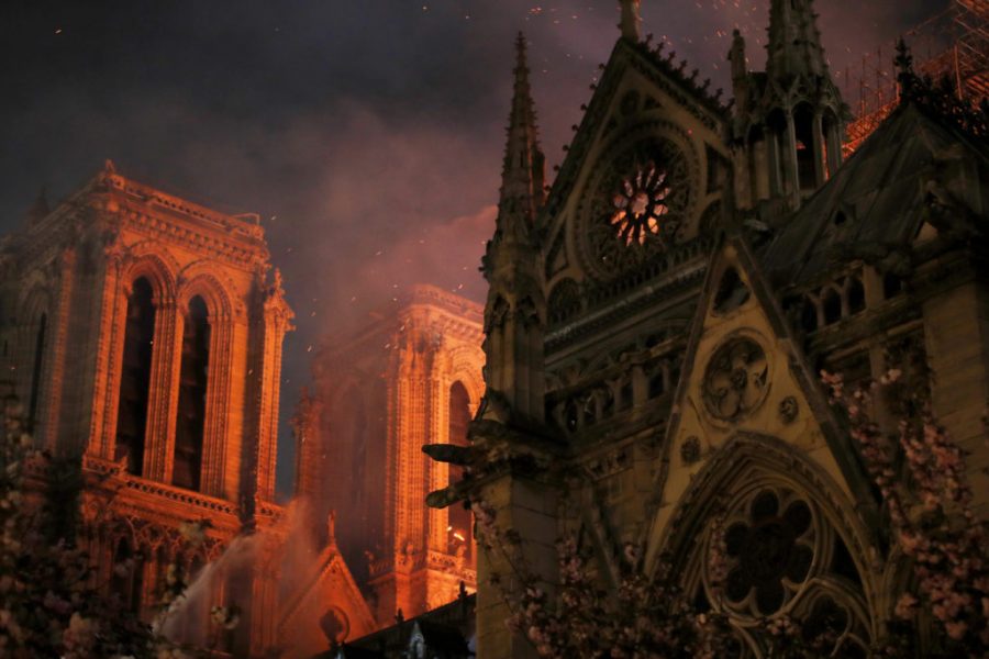 Sparks+fill+the+air+as+Paris+Fire+brigade+members+spray+water+to+extinguish+flames+as+the+Notre+Dame+Cathedral+burns+in+Paris%2C+France%2C+April+15%2C+2019.+++REUTERS%2FPhilippe+Wojazer