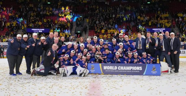 GOTHENBURG, SWEDEN - JANUARY 5: Team USA pose for a group photo with the championship trophy after a 6-2 gold medal game win against Team Sweden at the 2024 IIHF World Junior Championship at Scandinavium on January 5, 2024 in Gothenburg, Sweden. (Photo by Matt Zambonin/IIHF)